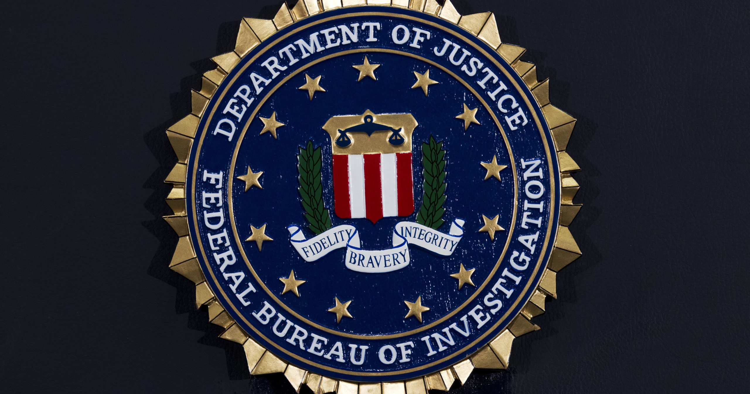 This June 14, 2018, file photo shows the FBI seal at a news conference at FBI headquarters in Washington.