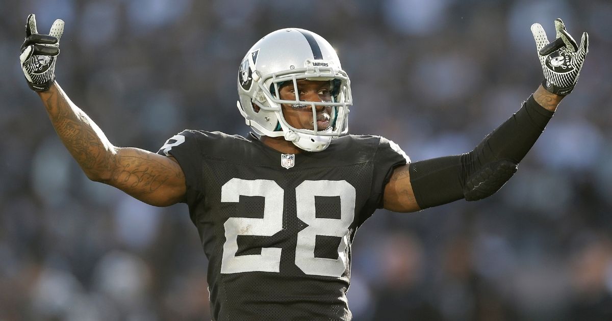 Phillip Adams gestures while playing for the Oakland Raiders against the Kansas City Chiefs on Dec. 15, 2013