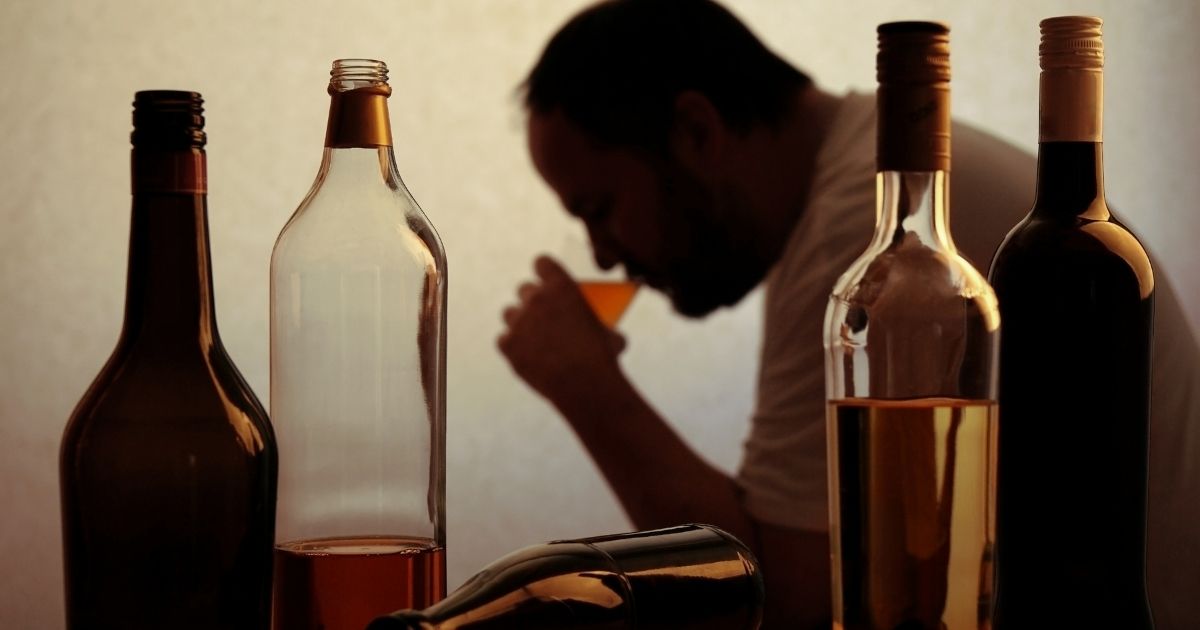 A person addicted to alcohol is pictured in the stock image above.