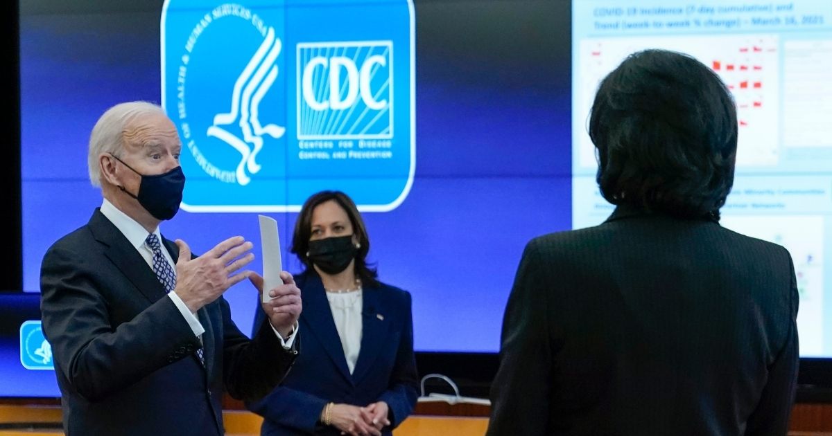 President Joe Biden speaks as Vice President Kamala Harris, center, and CDC Director Rochelle Walensky listen during a COVID-19 briefing at the headquarters of the Centers for Disease Control and Prevention in Atlanta on March 19.