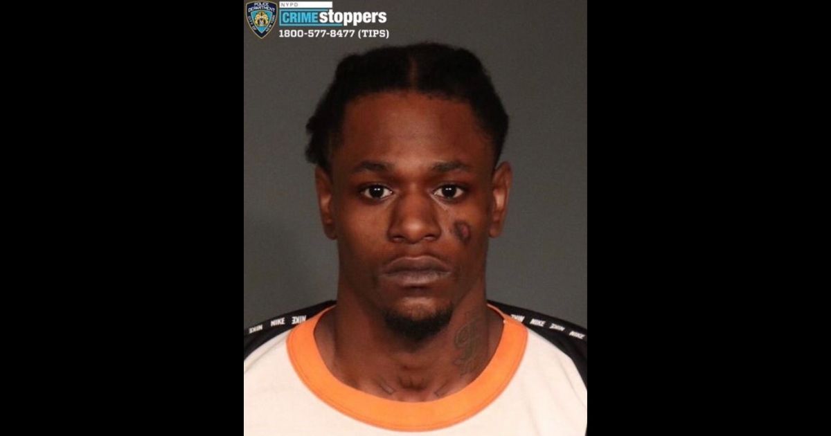 The mugshot of Christopher Buggs, 26, is shown above. Buggs is wanted on a 2018 murder charge.