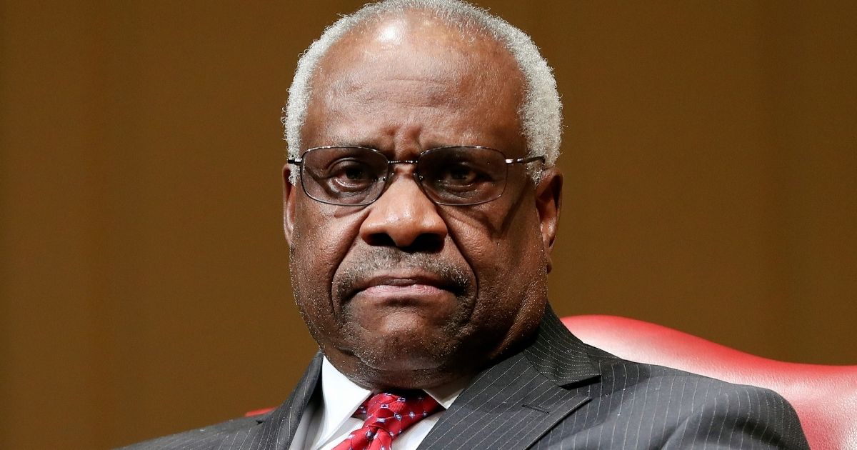 Supreme Court Associate Justice Clarence Thomas sits as he is introduced during an event at the Library of Congress in Washington, D.C., on Feb. 15, 2018.