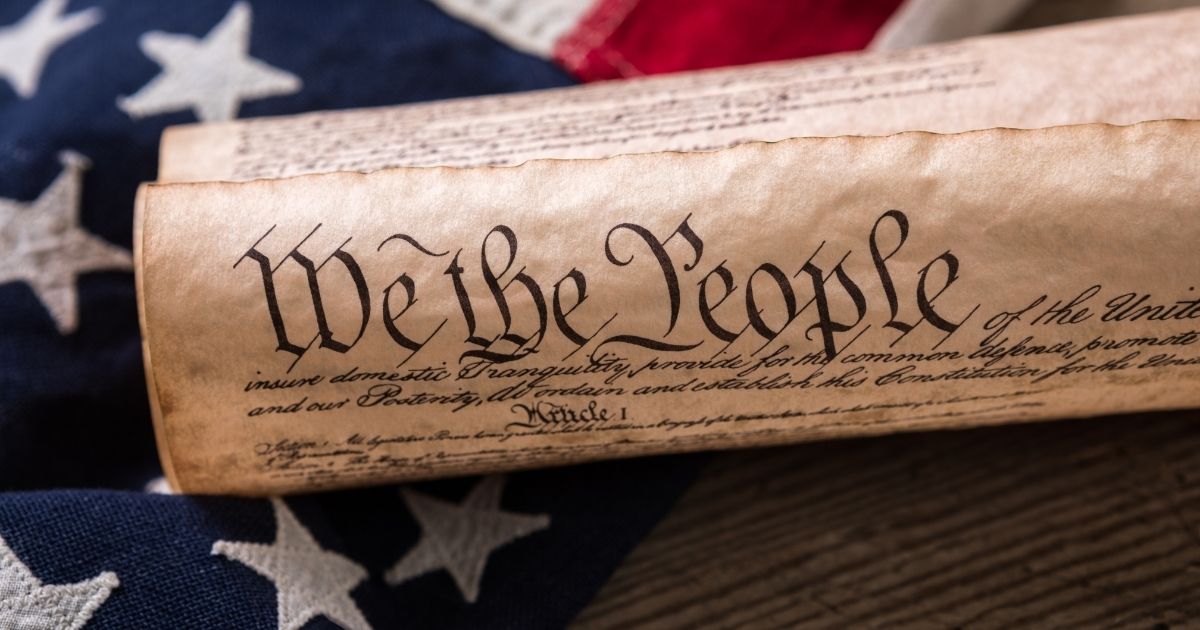 The U.S. Constitution is pictured in the stock image.