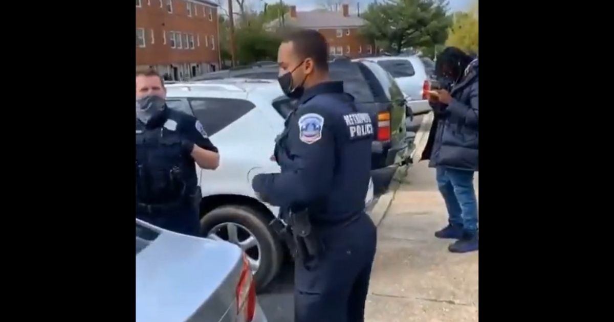 Police officers respond to a heckler who asked them about Ma'Khia Bryant.