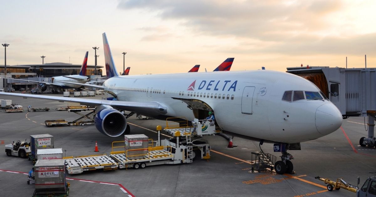 A Delta Air Lines plane is pictured at an airport in the stock image above.