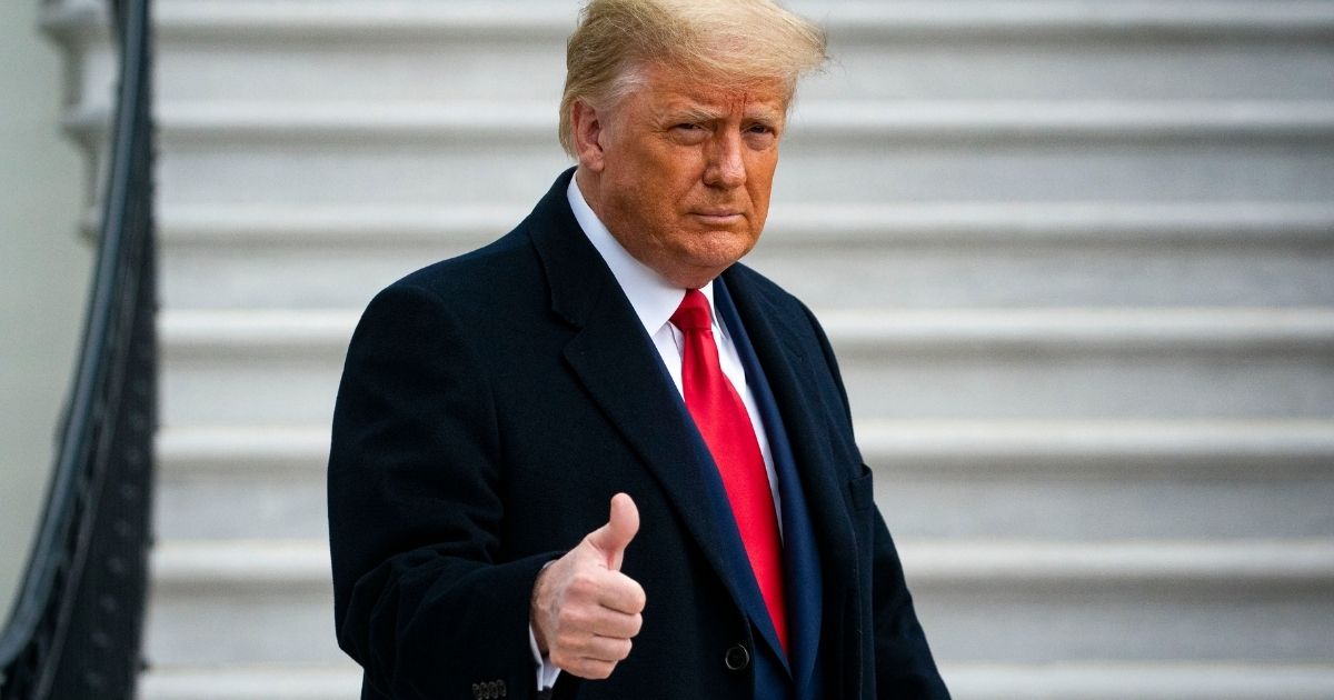 President Donald Trump gives a thumbs up as he departs on the South Lawn of the White House, on Dec. 12, 2020, in Washington, D.C.