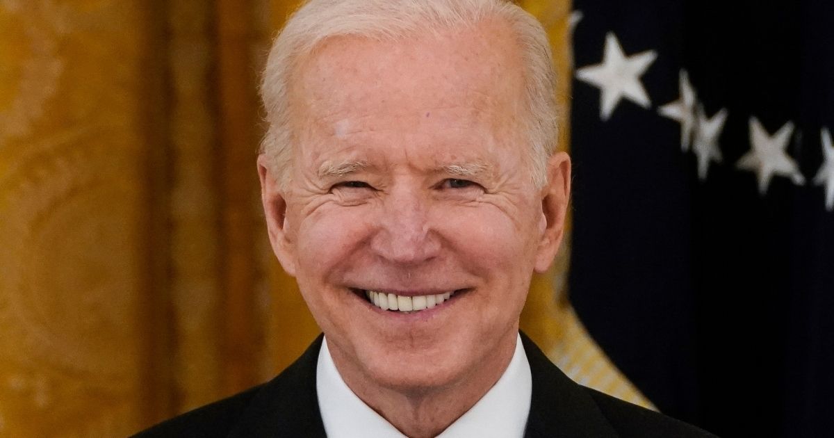 President Joe Biden smiles during a Cabinet meeting in the East Room of the White House in Washington on April 1.