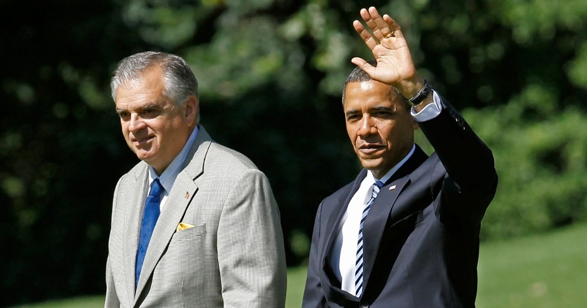 Ray LaHood, who was transportation secretary at the time, walks with then-President Barack Obama across the South Lawn of the White House in Washington before departing aboard Marine One on June 18, 2010.