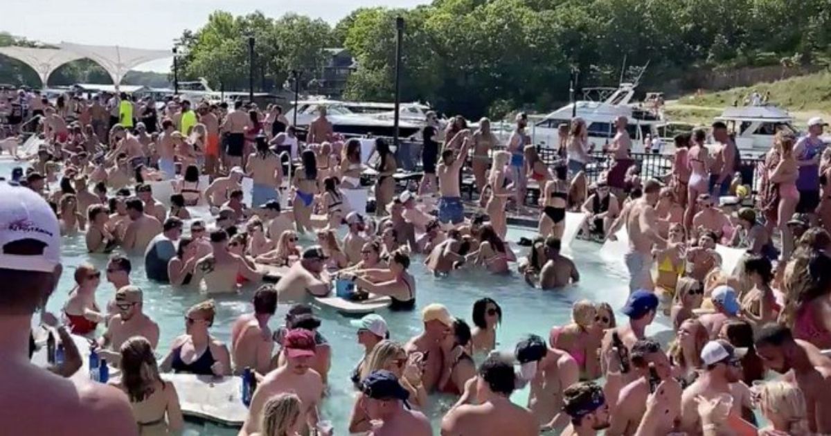 A crowded group of revelers celebrate Memorial Day weekend at Osage Beach of the Lake of the Ozarks, Missouri, on May 23.