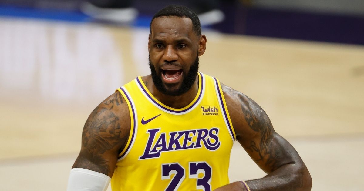 LeBron James of the Los Angeles Lakers reacts during the second half of the NBA preseason game against the Phoenix Suns at Talking Stick Resort Arena on Dec. 18, 2020, in Phoenix.