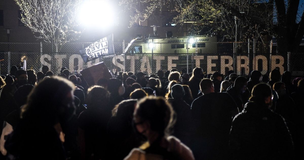 Demonstrators gather during the seventh night of protests over the shooting death of Daunte Wright in Brooklyn Center, Minnesota, on April 17, 2021.