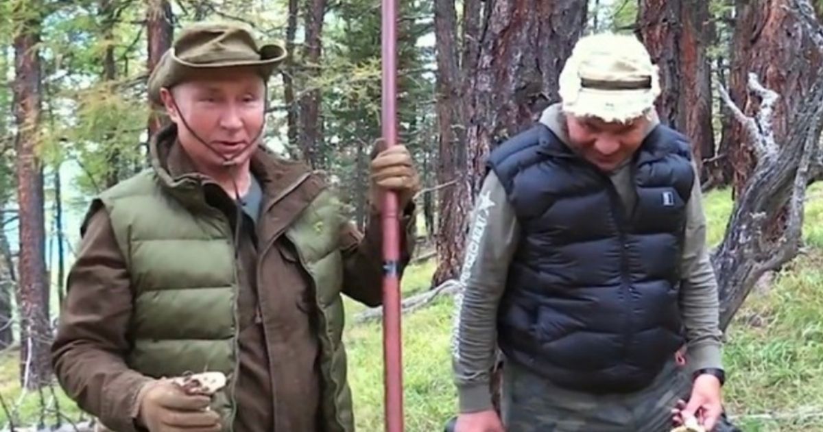 Vladimir Putin, left, is shown walking in the forest with Sergey Kuzhugetovich Shoigu, right, the Minister of Defence of the Russian Federation.