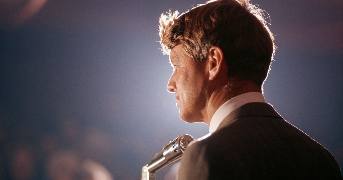 Robert F. Kennedy speaks into a microphone at an unspecified rally during his campaign for the Democratic Party's presidential nomination in 1968.