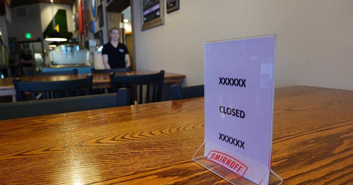 A table is blocked off for social distancing at the Someplace Else II bar and restaurant in Elkhorn, Wisconsin, on May 15.
