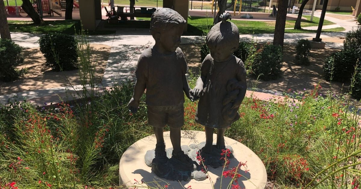 A statue of children holding hands is seen at the StreetLightUSA shelter in the Phoenix area.