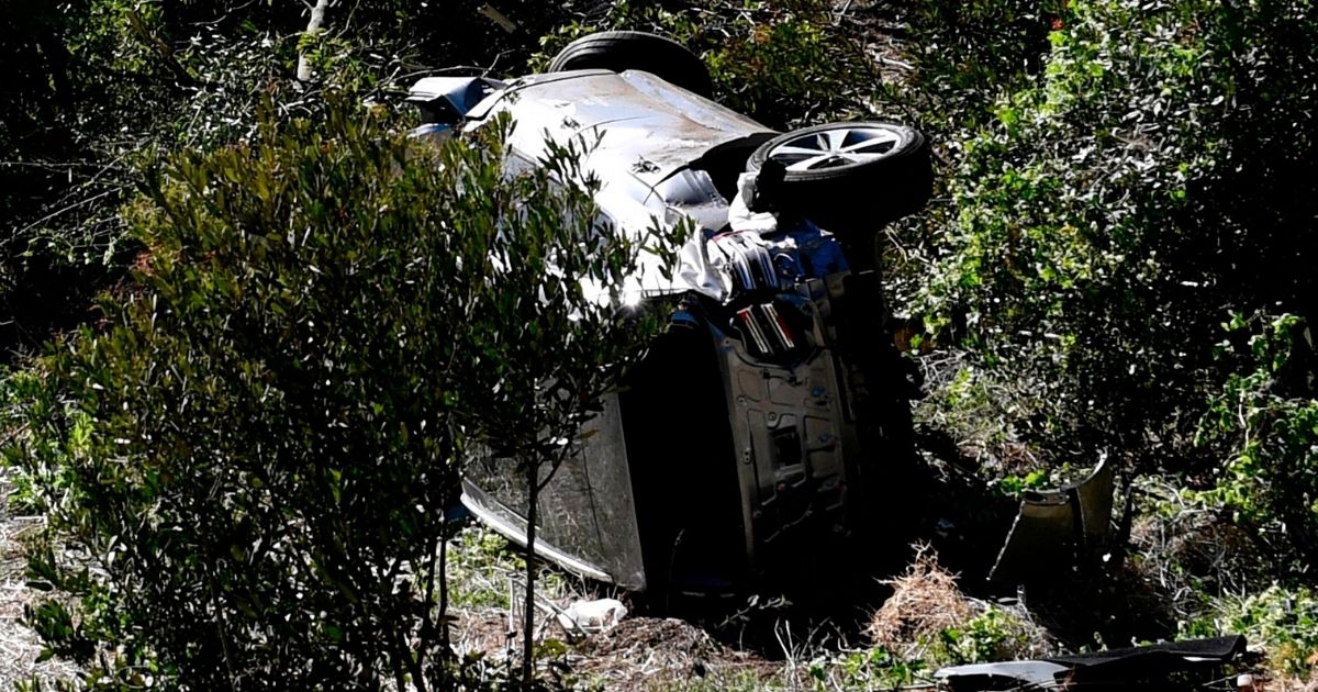 The vehicle driven by golfer Tiger Woods lies on its side in Rancho Palos Verdes, California, on Feb. 23, 2021, after a rollover accident.