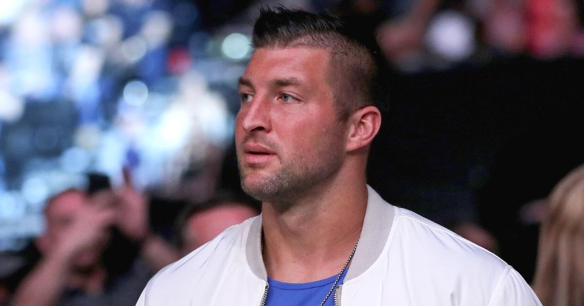 Tim Tebow watches UFC 261 at VyStar Veterans Memorial Arena in Jacksonville, Florida, on Saturday.