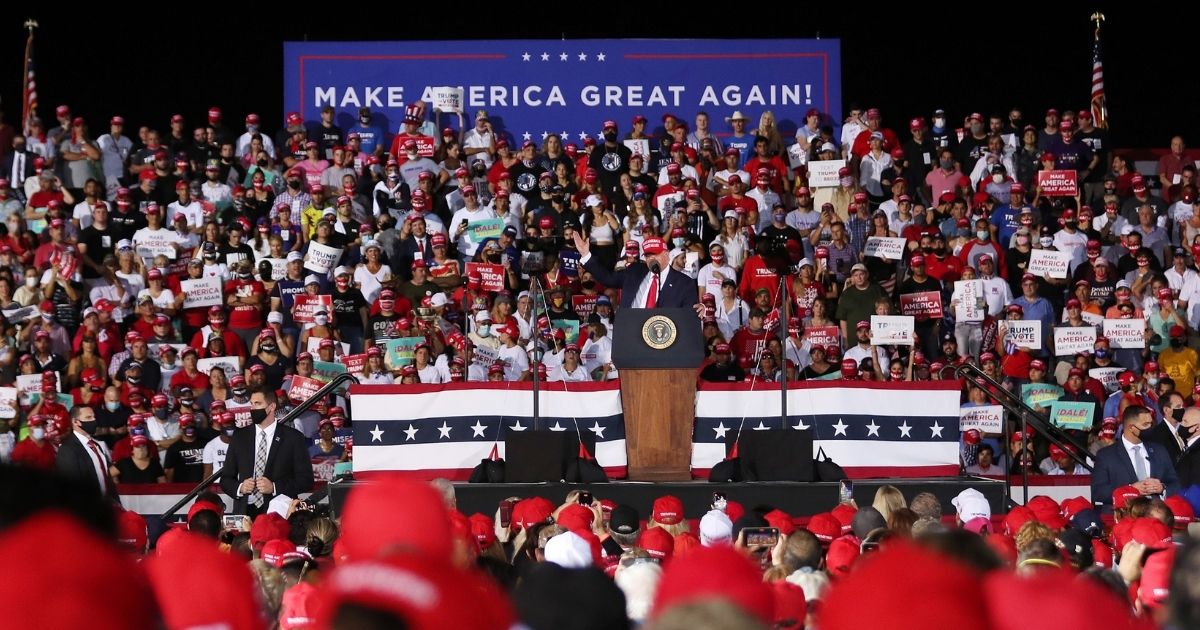 Then-President Donald Trump speaks to a crowd of supporters during a "Make America Great Again" campaign rally at the Miami-Opa Locka Executive Airport in Opa Locka, Florida, on Nov. 1.