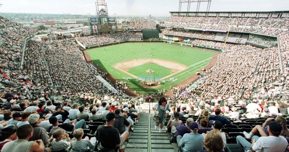 Fans filling the seats of Coors Field in a 1998 file photo.