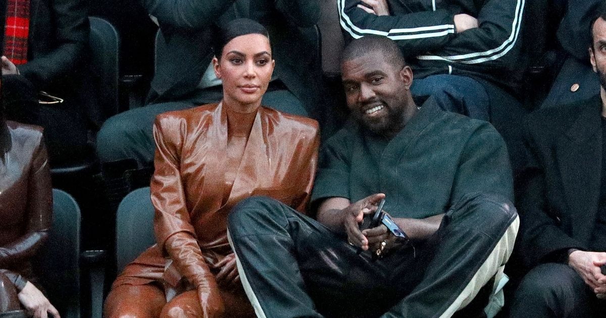 Kim Kardashian West and her husband, Kanye West, attend a fashion show in Paris on March 1, 2020.