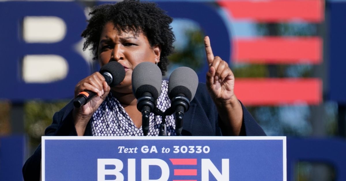Voting rights activist Stacey Abrams campaigns for Joe Biden at Turner Field in Atlanta on Nov. 2, 2020.