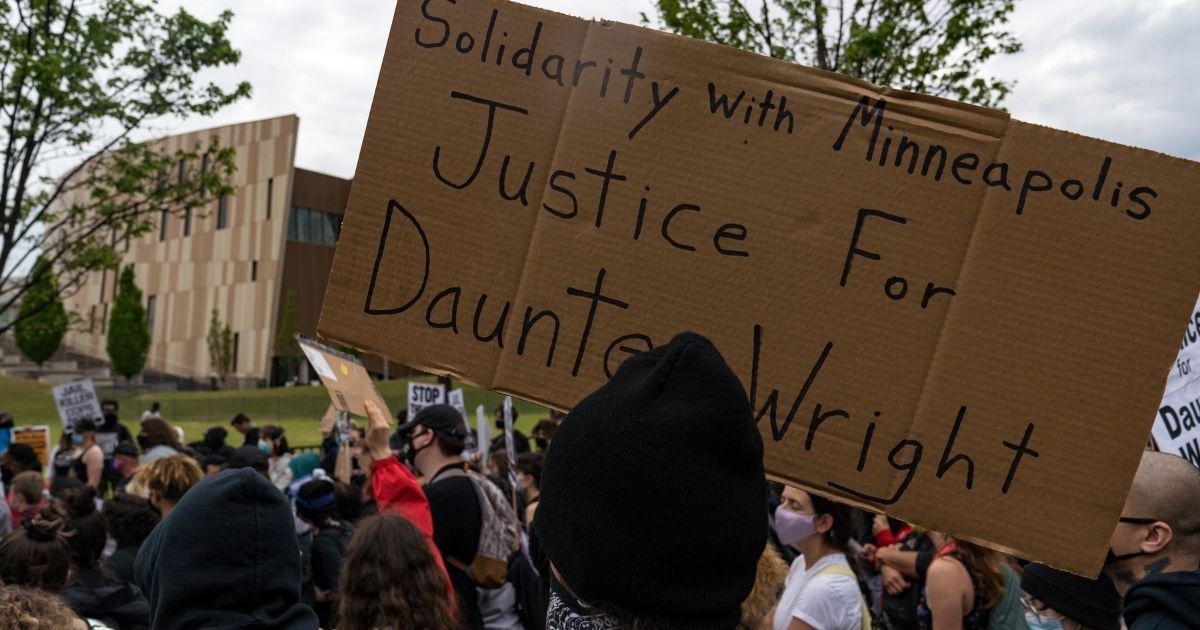 Demonstrators in Atlanta march to the National Center for Civil and Human Rights on April 14, 2021, while protesting the shooting death of Daunte Wright. Wright, a black man who had been pulled over for a traffic stop near Minneapolis on April 11, was shot and killed by an officer who police say mistook her gun for a Taser.
