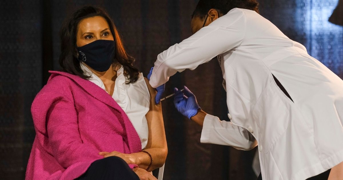 Michigan Gov. Gretchen Whitmer is pictured in an April 6 file photo receiving a dose of the Pfizer COVID-19 vaccine at Ford Field in Detroit.