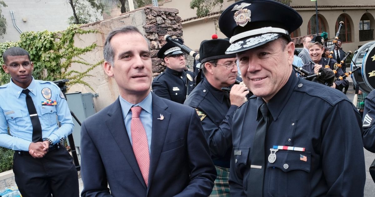 Los Angeles Mayor Eric Garcetti is pictured with Police Chief Michel Moore in a 2018 file photo.