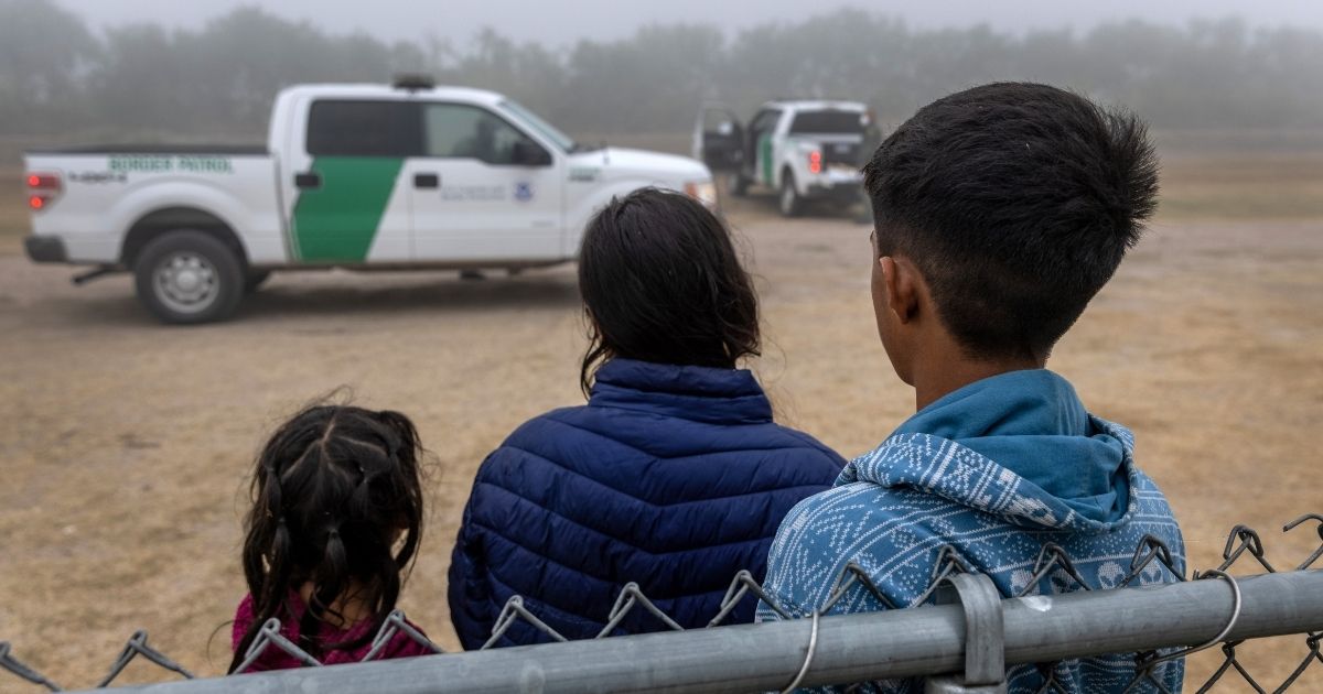 Unaccompanied minors wait to be processed by U.S. Border Patrol agents near the U.S.-Mexico border on April 10, 2021, in La Joya, Texas.