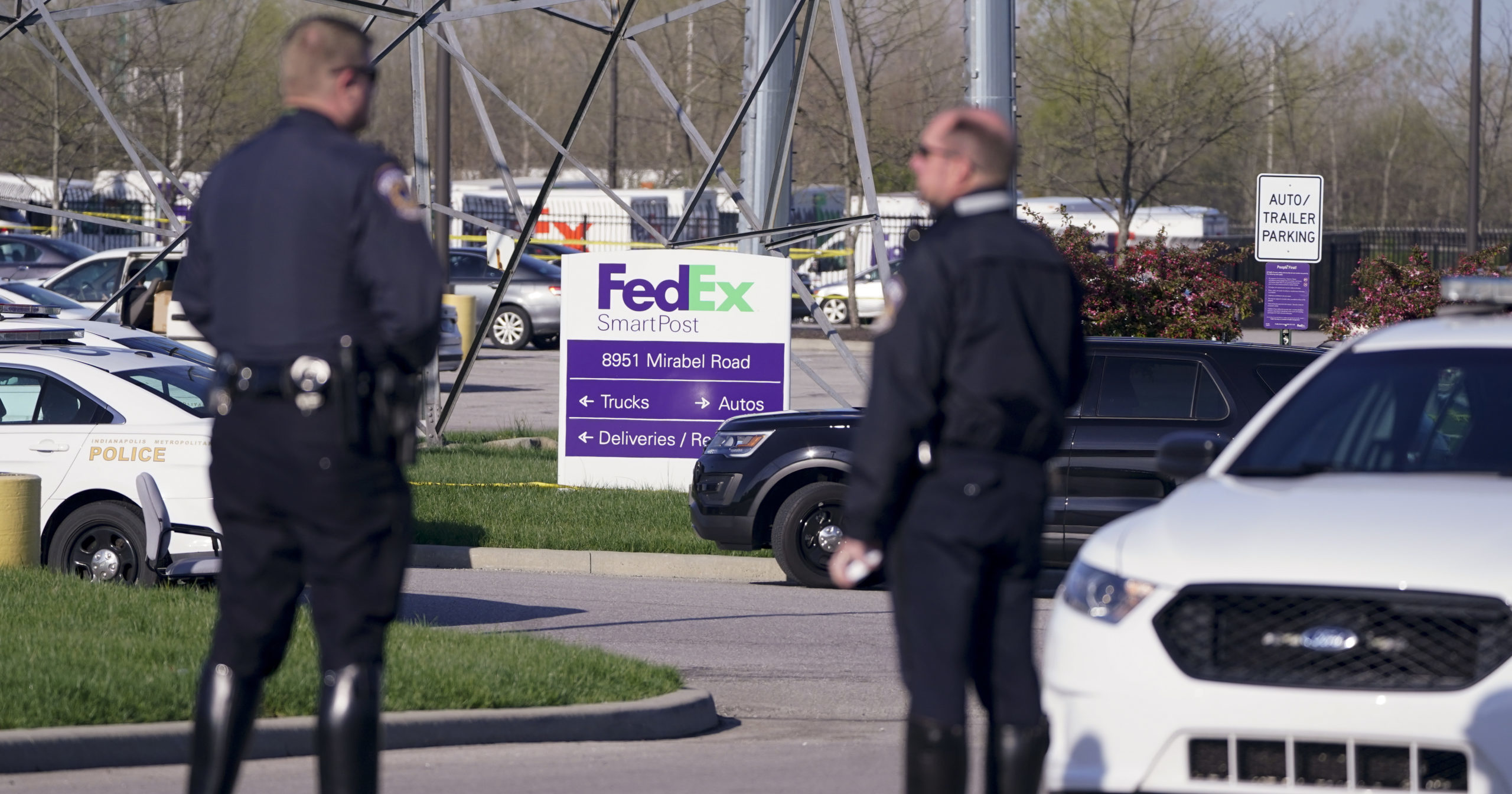 Police stand near the scene of a shooting at a FedEx facility in Indianapolis, Indiana, on April 16, 2021.