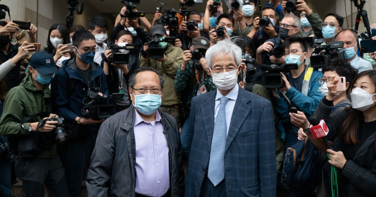 Pro-democracy activists Martin Lee, right, and Albert Ho, left, arrive at a court in Hong Kong on Friday.