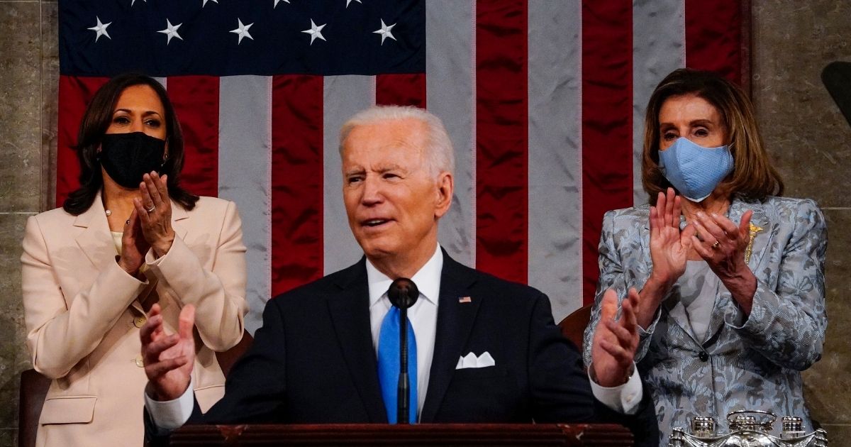 President Joe Biden addresses a joint session of Congress as Vice President Kamala Harris and Speaker of the House Nancy Pelosi look on in the House chamber of the U.S. Capitol on April 28, 2021, in Washington, D.C.