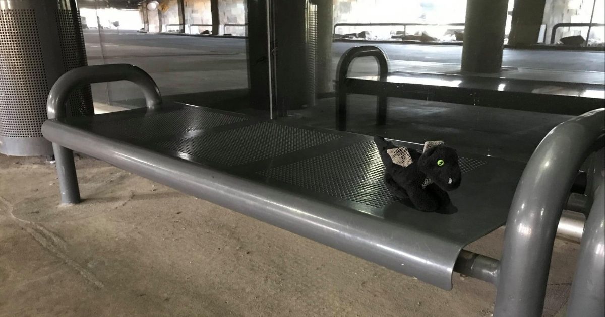 Scale' the stuffed dragon tours the airport in Oklahoma City after being found, thanks to some caring employees with a sense of humor.