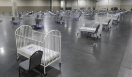 Cots and cribs are arranged at the Mountain America Expo Center in Sandy, Utah, on April 6, 2020, for hospital overflow amid the coronavirus pandemic.