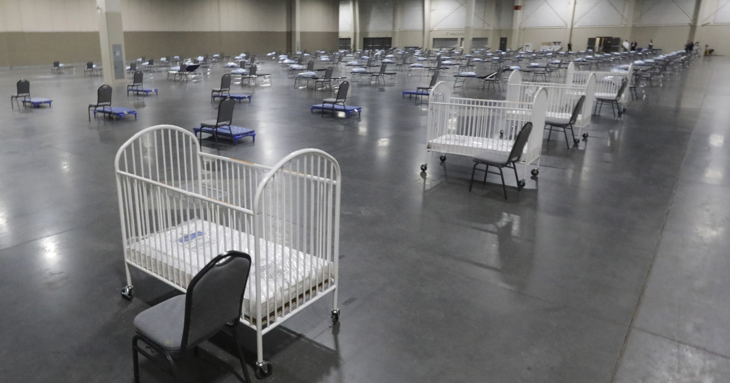 Cots and cribs are arranged at the Mountain America Expo Center in Sandy, Utah, on April 6, 2020, for hospital overflow amid the coronavirus pandemic.