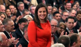 Republican Rep. Elise Stefanik of New York stands as she's acknowledged by then-President Donald Trump as he speaks one day after the Senate acquitted him on two articles of impeachment in the East Room of the White House on Feb. 6, 2020, in Washington, D.C.