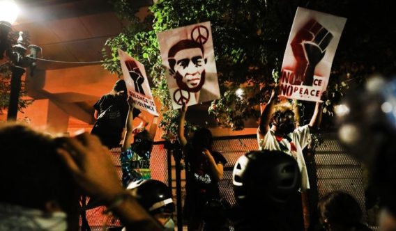 People gather to protest in front of the Mark O. Hatfield federal courthouse in downtown Portland as the city experiences another night of unrest on July 27, 2020, in Portland, Oregon.