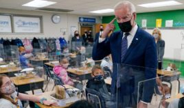 President Joe Biden gestures as he talks to students during a visit to Yorktown Elementary School on Monday in Yorktown, Virginia, as first lady Jill Biden looks on.