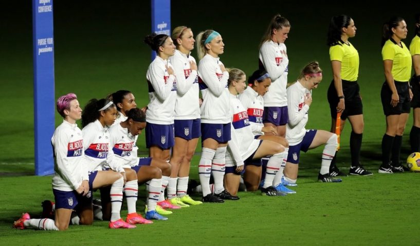 United States players kneel for the American national anthem during the SheBelieves Cup at Exploria Stadium on February 18, in Orlando, Florida.