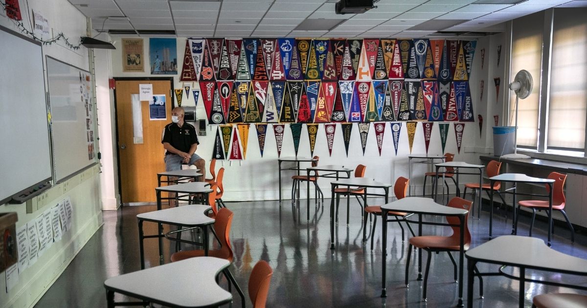 Stamford High School principal Raymond Manka sits in a socially distanced classroom in Stamford, Connecticut, on Aug. 26.