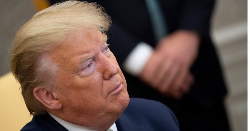 Then-President Donald Trump listens to questions from the media before a meeting with Ireland Prime Minister Leo Varadkar in the Oval Office of the White House March 12, 2020, in Washington, D.C.