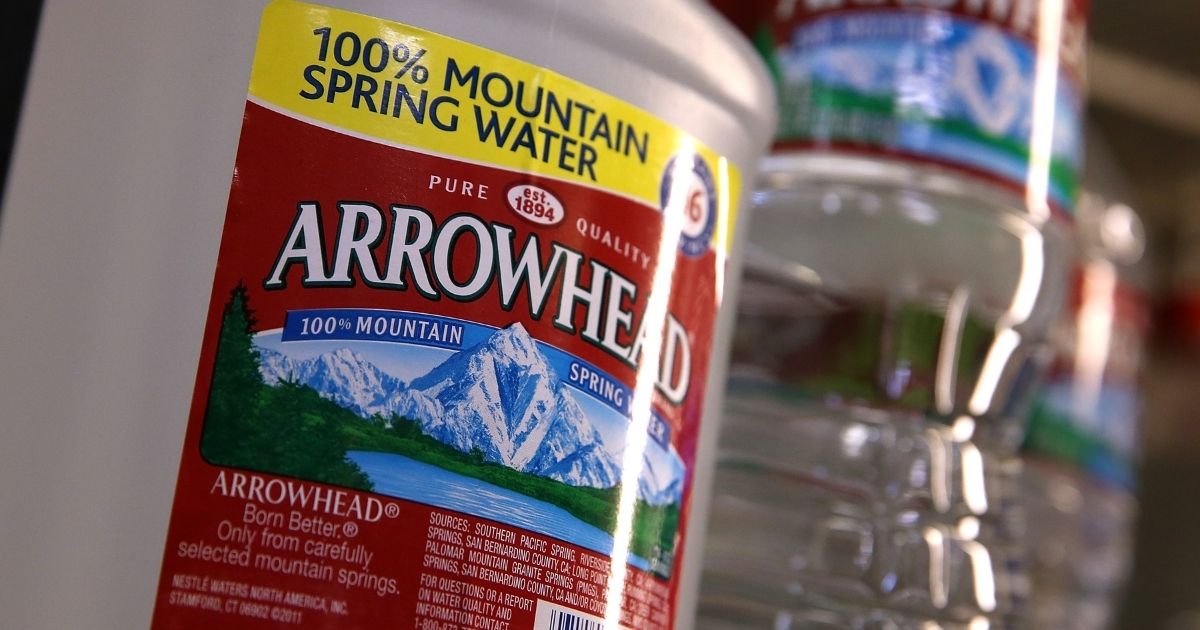 Bottles of Arrowhead water are displayed at a convenience store in San Rafael, California. The Nestlé company bottled and sold the water under the Arrowhead brand. The company recently sold its North American water arm to BlueTriton for $4.3 billion.
