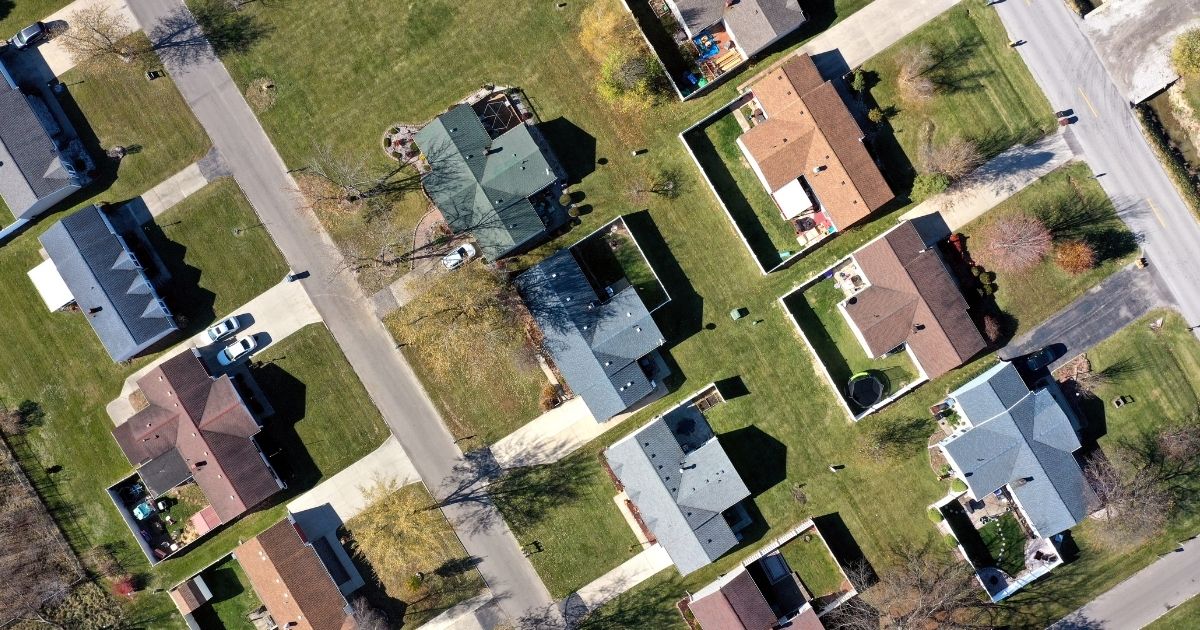 This stock image shows an overhead view of a block of houses.