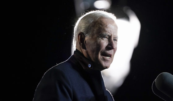 In this Oct. 26, 2021, file photo President Joe Biden speaks at a rally for Democratic gubernatorial candidate, former Virginia Gov. Terry McAuliffe, Tuesday, Oct. 26, 2021, in Arlington, Va. As Biden and Democrats try to get a roughly $2 trillion package over the finish line, a new poll shows that Biden faces an increasingly pessimistic nation and an underwater approval rating on his handling of the nation’s economy.