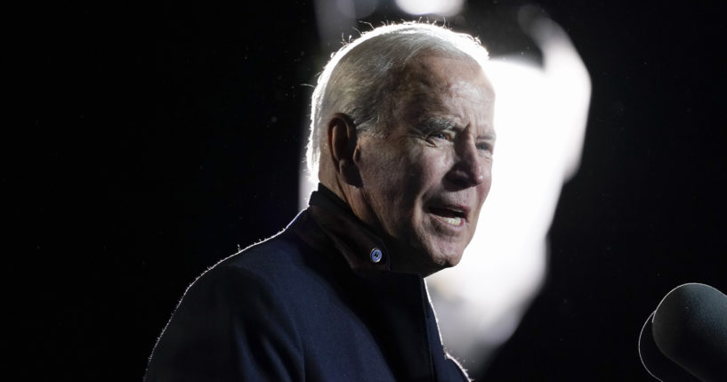 In this Oct. 26, 2021, file photo President Joe Biden speaks at a rally for Democratic gubernatorial candidate, former Virginia Gov. Terry McAuliffe, Tuesday, Oct. 26, 2021, in Arlington, Va. As Biden and Democrats try to get a roughly $2 trillion package over the finish line, a new poll shows that Biden faces an increasingly pessimistic nation and an underwater approval rating on his handling of the nation’s economy.