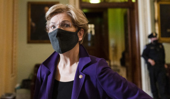 Sen. Elizabeth Warren of Massachusetts speaks to a reporter on Capitol Hill in a Dec. 7 file photo.