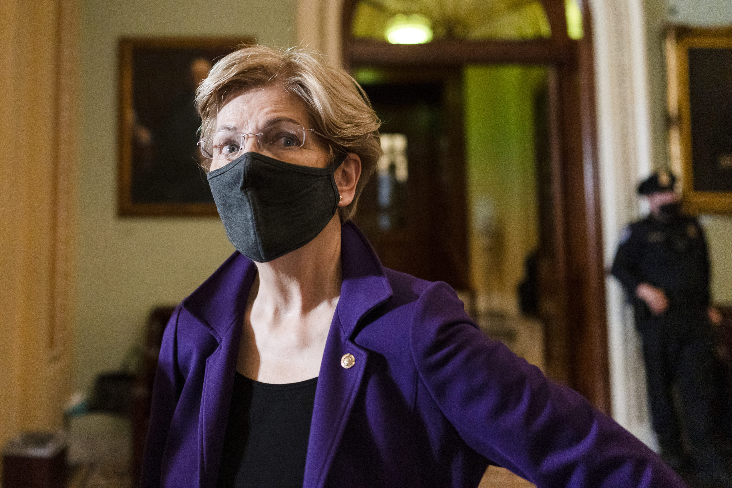 Sen. Elizabeth Warren of Massachusetts speaks to a reporter on Capitol Hill in a Dec. 7 file photo.