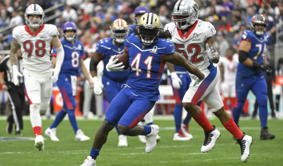 NFC running back Alvin Kamara (41) of the New Orleans Saints rushes during the first half of the NFL's Pro Bowl on Feb. 6, 2022.