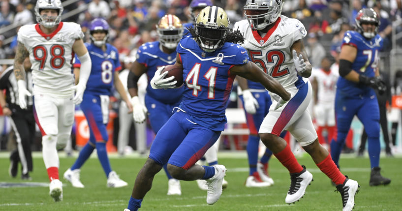 NFC running back Alvin Kamara (41) of the New Orleans Saints rushes during the first half of the NFL's Pro Bowl on Feb. 6, 2022.