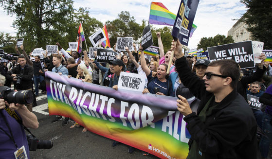 Supporters of gay, lesbian and transgender rights stage a protest in front of the U.S. Supreme Court in a 2019 file photo.